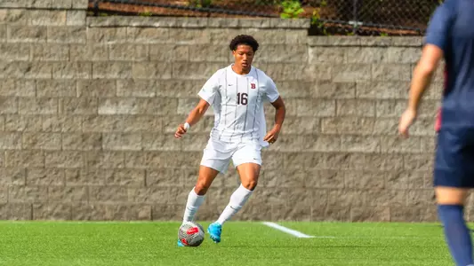 Shayne Thompson dribbles the soccer ball