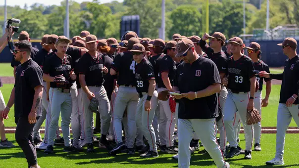 Baseball huddles after defeating Columbia in the Ivy Tournament
