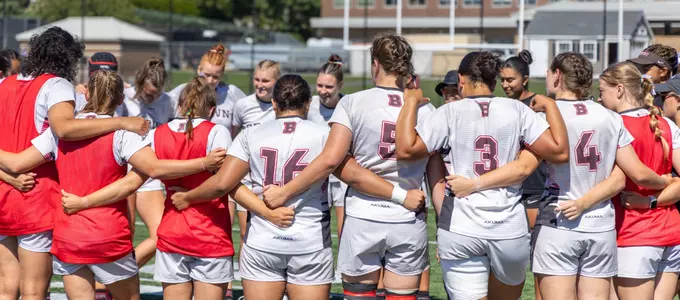 Women's Rugby Group Huddle