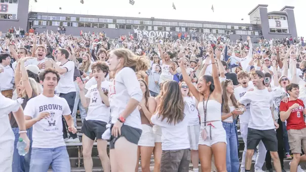 Brown fans cheer against Harvard in 2024