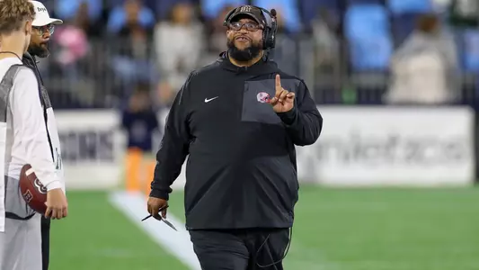 Willie Edwards coaches in the 2025 Governor's Cup vs. URI
