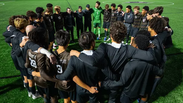 Brown men's soccer team huddle