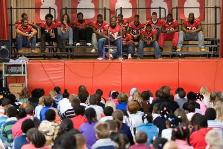 Football Players Participate in Read-A-Thon