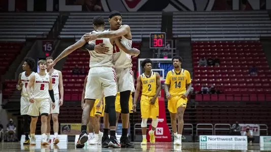 Ball State basketball players hug