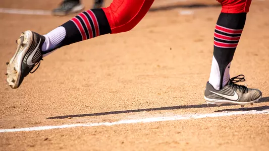 Softball Player Running Down Line