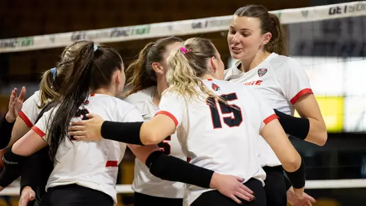 Madison Buckley Huddle in MAC Quarterfinals