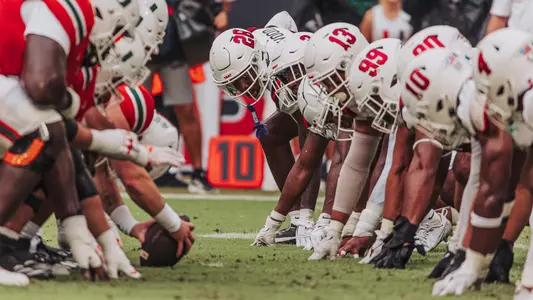 Football Huddle vs. Miami