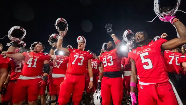 Football celebrates its win over Ohio