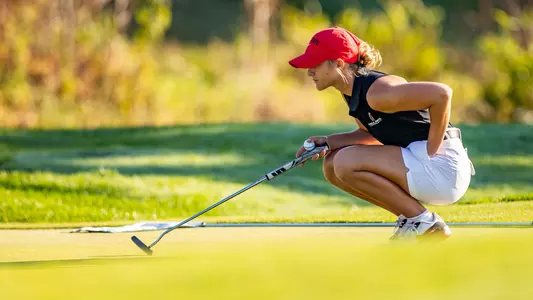 Skylar Dean looking over a putt at the Brittany Kelly Classic