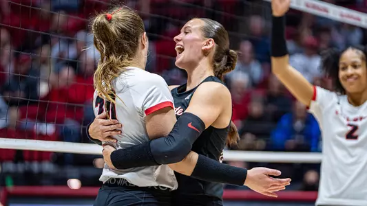 Carson Tyler and Sophie Ledbetter celebrate a Ball State point