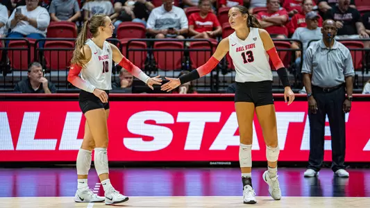 Noelle VanOort and Gwen Crull celebrate vs. Cedarville
