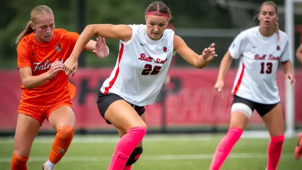 Annika Klauss dribbles the ball against a Bowling Green defender