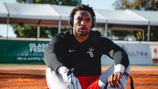 Cincear Lewis sits on field prior to game seven at Bowling Green