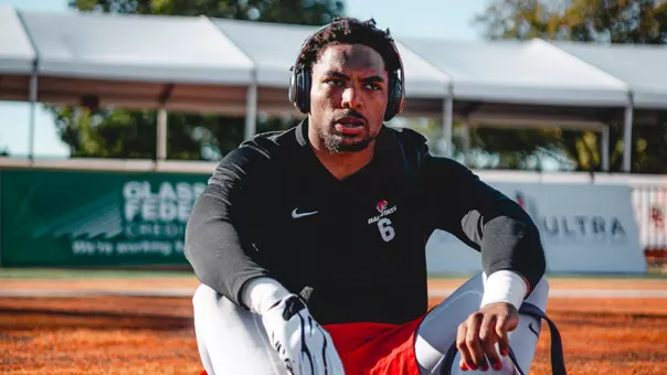 Cincear Lewis sits on field prior to game seven at Bowling Green