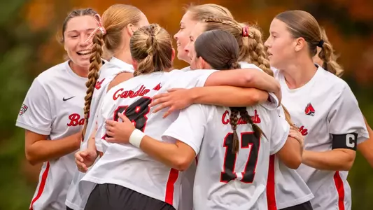 Ball State's soccer team embraces each other
