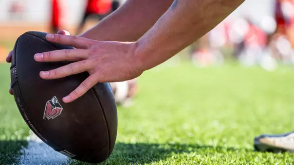 Caden Britton long-snapping football