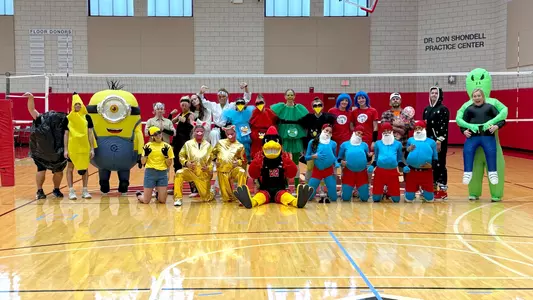 Ball State women's volleyball poses for a team picture in costumes before its annual Halloween practice on Wednesday, Oct. 29.