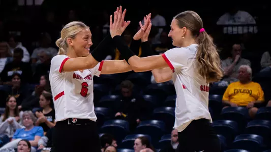 Merritt Sliwa and Tiffany Snook high five in Ball State's Oct. 3, 2026 setback at Toledo