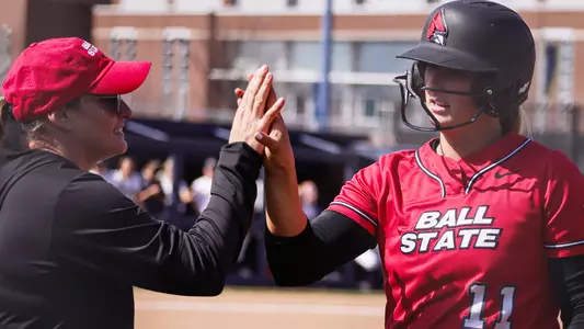 Helen Pena and Ella Whitney High Five