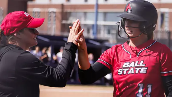 Helen Pena and Ella Whitney High Five