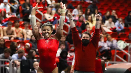 Alauna Simms & Scott Wilson celebrating her floor routine at the SEMO Quad Meet