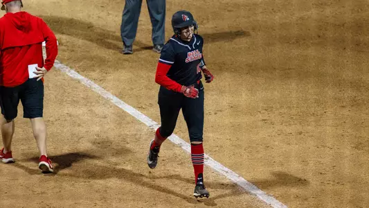 Lindsey DeRoeck celebrates her home run in Saturday's game versus FGCU