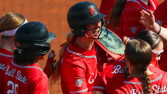 Ella Whitney celebrates her grand slam vs. Bellarmine