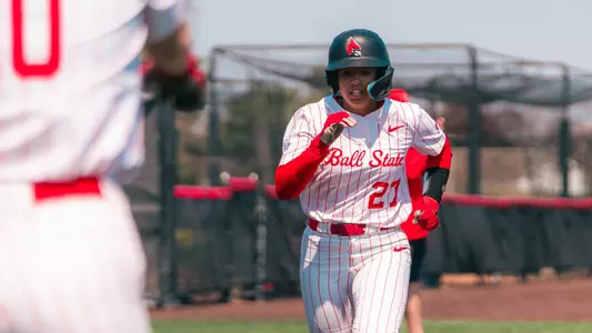 Ball State softball's Payton Fox running from third base to home plate to score one of the Cardinals' three runs in the April 12, 2026 home game versus Western Michigan.