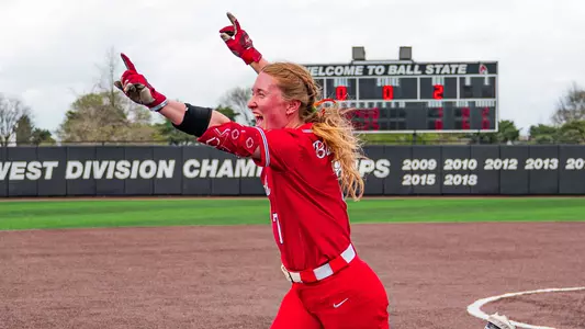 Ball State junior shortstop Maia Pietrzak in her red uniform running home to celebrate her walk off hit by pitch in Wednesday's 8-7 victory over Indiana State at the Ball State Softball Stadium.