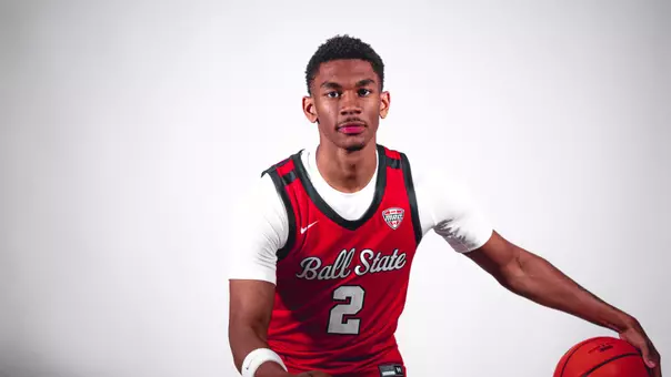 Kamden McGilverary posing in a red Ball State men's basketball jersey
