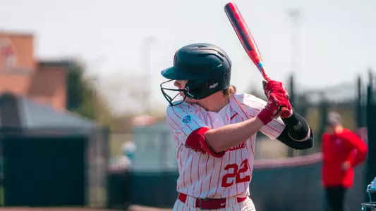 Ball State softball's Allee Noble in her white pinstripe uniform waiting for a pitch in the April 12, 2026 game versus Western Michigan
