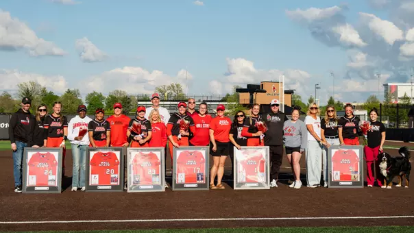 Ball State softball's 2026 senior class and their families pose for a pitcher at the Ball State Softball Stadium after Saturday's doubleheader sweep of Kent State.