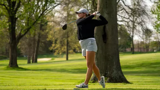 Senior Sabrina Langerak teeing off in the second round of the 2026 MAC Women's Golf Championships at Firestone Country Club.