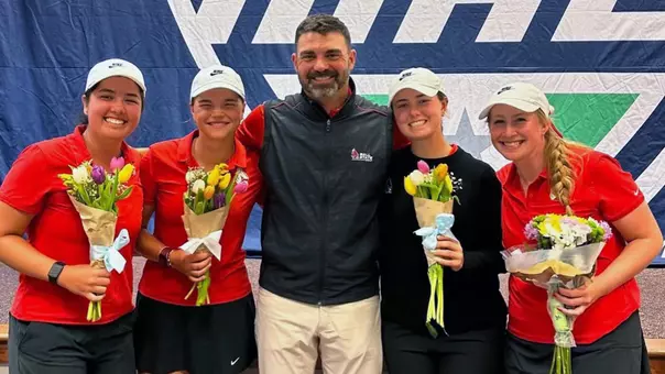 Ball State women's golf seniors pose with flowers and coach at the MAC Championships: (L to R) Jasmine Driscoll, Sabrina Langerak, Cameron Andry, Sarah Gallagher and Madelin Boyd.