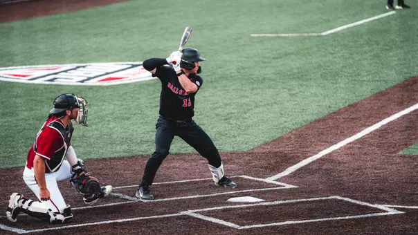 Brayden Huebner takes an at-bat against UMass on April 25th, wearing a black jersey.