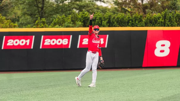 Brayden Huebner in a Ball State baseball uniform in the outfield