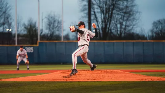John Chambers in a grey Ball State baseball uniform pitching