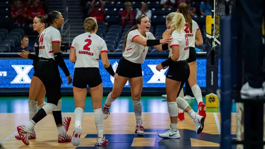 The Ball State women's volleyball team celebrates a point in Saturday's win over Xavier.