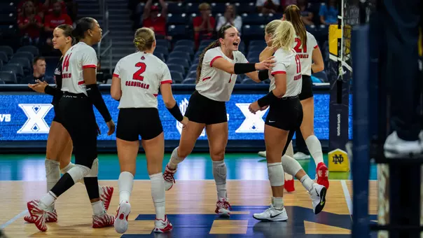 The Ball State women's volleyball team celebrates a point in Saturday's win over Xavier.