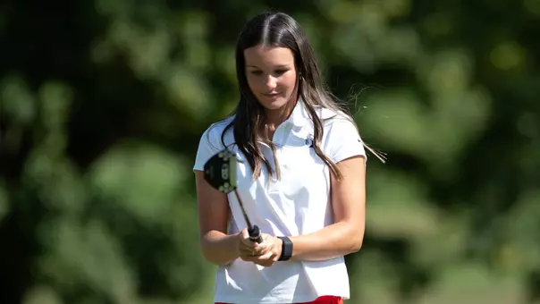 Taylor Larkins preparing to putt in a posed photo from Ball State women's golf photo day at the Delaware Country Club