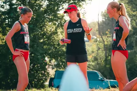 Coach Rachel Nichwitz Holds a Post-Race Discussion with Kaitlyn Kauppila and Emily Decker