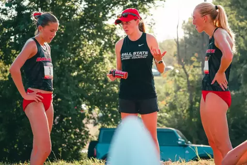 Coach Rachel Nichwitz Holds a Post-Race Discussion with Kaitlyn Kauppila and Emily Decker
