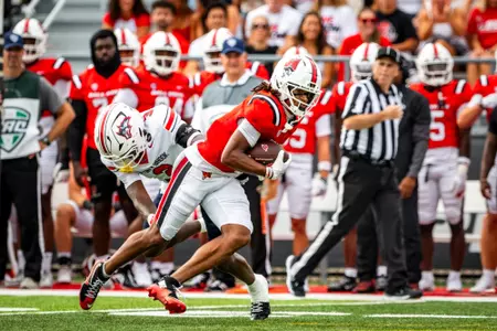 Kamron Chamble carrying the ball after completing an interception versus Stony Brook 9-12-26
