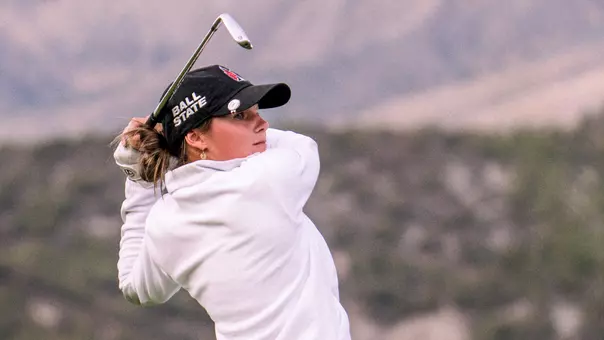 Taylor Larkins takes an iron shot in the first round of the Golfweek Red Sky Classic