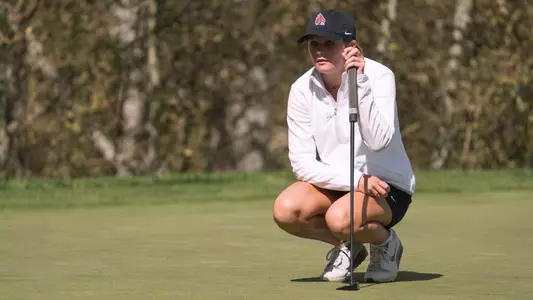 Taylor Larkins looking over a putt at the Red Sky Classic