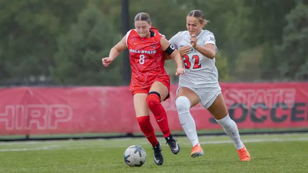 Audrey Goodyear in a red Ball State uniform running after the ball