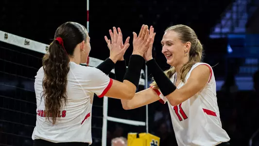 Tiffany Snook and Audrey Geer high five during the team's match versus Xavier on Aug. 29, 2026.