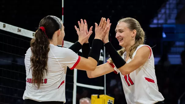 Tiffany Snook and Audrey Geer high five during the team's match versus Xavier on Aug. 29, 2026.