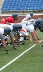 Bison Gridders Practice in Full Pads for First Time