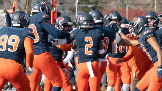 The Bison celebrate Brandon Benson's interception